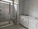 Bathroom with double vanity and a large walk-in shower at 1237 Crested Iris Way, North Myrtle Beach, SC 29582