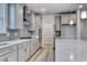 Gray cabinets and quartz countertops in this kitchen at 1310 Crested Iris Way, North Myrtle Beach, SC 29582