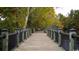 Scenic boardwalk view with black metal railing and wooden planks, perfect for leisurely strolls at 1518 Clubstone Dr., Conway, SC 29526