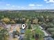 An aerial view of the home pinpointing its location near a tree-lined neighborhood at 1673 Middleton St., Georgetown, SC 29440