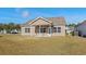 The home's backyard features a covered patio at 1711 Sapphire Dr., Longs, SC 29568