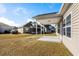 Backyard shows home's siding and patio area at 1711 Sapphire Dr., Longs, SC 29568