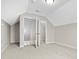 Neutral bedroom features carpet, and open closet space with ample storage at 1711 Sapphire Dr., Longs, SC 29568