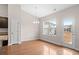 Dining area featuring wood floors, chandelier lighting, and a door leading to the exterior at 1711 Sapphire Dr., Longs, SC 29568