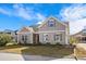 Charming two-story home featuring neutral siding, complementary trim, manicured landscaping, and a well-maintained lawn at 1711 Sapphire Dr., Longs, SC 29568