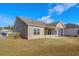 Side view of home with covered patio at 1711 Sapphire Dr., Longs, SC 29568