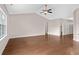 Open-concept space featuring hardwood floors, archways, neutral paint, high ceilings and staircase access at 1711 Sapphire Dr., Longs, SC 29568