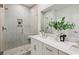 Modern bathroom featuring a glass-enclosed shower with unique tilework and double vanity at 2400 Hillbourne Loop, North Myrtle Beach, SC 29582