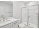 Minimalist bathroom with white fixtures, a walk-in shower, and a large mirror at 2400 Hillbourne Loop, North Myrtle Beach, SC 29582