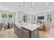 Open-concept kitchen with stainless appliances and a view of the dining area and living room at 2400 Hillbourne Loop, North Myrtle Beach, SC 29582