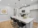 Modern kitchen features a quartz countertop island with pendant lighting and stainless steel appliances at 2400 Hillbourne Loop, North Myrtle Beach, SC 29582