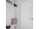 Functional mudroom with a built-in bench, storage, and neutral decor at 2400 Hillbourne Loop, North Myrtle Beach, SC 29582