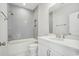 Modern bathroom featuring tiled shower and tub combo, sleek vanity with sink, and stylish fixtures at 2620 Hillbourne Loop, North Myrtle Beach, SC 29582