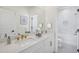 Bright bathroom featuring double sinks, modern gold hardware, and tile floors at 2624 Hillbourne Loop, North Myrtle Beach, SC 29582