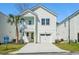 Charming two-story home with white siding, a yellow front door, and a one-car garage at 2624 Hillbourne Loop, North Myrtle Beach, SC 29582