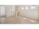 Spacious living room with light wood floors, neutral walls, and bright natural light at 2624 Hillbourne Loop, North Myrtle Beach, SC 29582