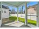 Screened in porch with bright green lawn and a view of a fenced in back yard at 2624 Hillbourne Loop, North Myrtle Beach, SC 29582