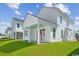 View of a covered back porch with blue ceiling, and an adjoining grass yard at 2628 Hillbourne Loop, North Myrtle Beach, SC 29582