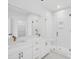 Modern bathroom with double sinks, a glass enclosed shower, and elegant white cabinetry at 2628 Hillbourne Loop, North Myrtle Beach, SC 29582