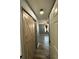 Hallway with barn door and wood-look floors at 3517 Crepe Myrtle Ct. # 3517, Myrtle Beach, SC 29577