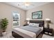 Beautifully staged bedroom decorated in soft, neutral tones with a large window for plenty of natural light at 765 Ashley Manor Dr., Longs, SC 29568