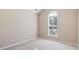 Neutral bedroom with a large window and blinds allowing for natural light at 765 Ashley Manor Dr., Longs, SC 29568