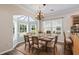 Charming dining room with a chandelier and lots of natural light from the bay window at 765 Ashley Manor Dr., Longs, SC 29568