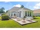 A well-furnished patio with comfortable outdoor seating and a dining area for entertaining at 765 Ashley Manor Dr., Longs, SC 29568
