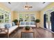 Bright and sunny sunroom with hardwood floors, a ceiling fan, and lots of natural light at 765 Ashley Manor Dr., Longs, SC 29568