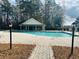 Sparkling community pool with a brick surround and a covered pavilion for relaxation at 765 Ashley Manor Dr., Longs, SC 29568