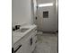 Bright bathroom with marble counters, black fixtures, and tiled shower at 1019 Muskeg Ct., Conway, SC 29526