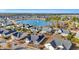 An aerial view of a lakefront community with landscaped lawns and beautiful homes around a tranquil lake at 1139 Parish Way, Myrtle Beach, SC 29577