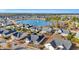 Aerial view showcasing the neighborhood homes around a beautiful lake, trees, and manicured lawns at 1139 Parish Way, Myrtle Beach, SC 29577
