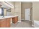 Bathroom featuring dual sinks with a large vanity mirror, a tile floor and a tub-shower combo at 1139 Parish Way, Myrtle Beach, SC 29577