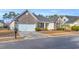 Charming single-story home featuring a brick facade, attached garage, and well-maintained front yard at 1139 Parish Way, Myrtle Beach, SC 29577