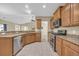 Functional kitchen with stainless steel appliances, granite countertops, and a tiled floor at 1139 Parish Way, Myrtle Beach, SC 29577