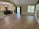 Spacious living area with hardwood floors, ample natural light, and sliding glass doors to the exterior at 1139 Parish Way, Myrtle Beach, SC 29577