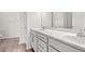 Bathroom featuring a dual-sink vanity with white countertops and cabinets at 1209 Cypress Shoal Dr., Conway, SC 29526