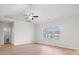 Serene bedroom with a vaulted ceiling, large window overlooking a pond, and a ceiling fan at 1209 Cypress Shoal Dr., Conway, SC 29526