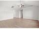 Spacious, bright living room boasts hardwood floors, a ceiling fan, and vaulted ceilings at 1209 Cypress Shoal Dr., Conway, SC 29526