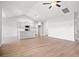Bright open-concept living space flows into the kitchen, featuring hardwood floors and modern finishes at 1209 Cypress Shoal Dr., Conway, SC 29526