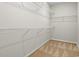 A walk-in closet features carpet and multiple white wire shelves for storage at 1209 Cypress Shoal Dr., Conway, SC 29526