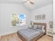 Bedroom with a bed, a large window with natural light, wood laminate floors, and vaulted ceiling at 210 26Th Ave. S, Myrtle Beach, SC 29577