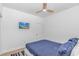 Bedroom with a ceiling fan, light wood laminate floors, and a flat screen TV on the wall at 210 26Th Ave. S, Myrtle Beach, SC 29577