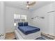 Bedroom with a ceiling fan, light wood laminate floors, and window with natural light at 210 26Th Ave. S, Myrtle Beach, SC 29577