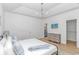 Bedroom with a ceiling fan, wood laminate floors, and closet with a white door at 210 26Th Ave. S, Myrtle Beach, SC 29577