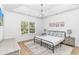 Bedroom with a large window, a ceiling fan, and wood laminate floors at 210 26Th Ave. S, Myrtle Beach, SC 29577