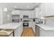 Well-equipped kitchen features stainless appliances, a spacious island with seating, and ample counter space at 210 26Th Ave. S, Myrtle Beach, SC 29577