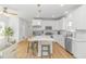 Bright, open kitchen featuring a large island, stainless appliances, and seamless flow to the living area at 210 26Th Ave. S, Myrtle Beach, SC 29577