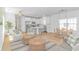 Open floor plan featuring a living area, dining space, and a modern kitchen with stainless appliances at 210 26Th Ave. S, Myrtle Beach, SC 29577